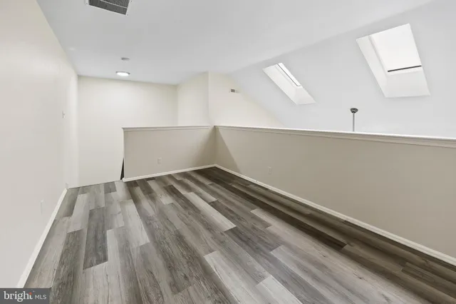 a view of a balcony with wooden floor