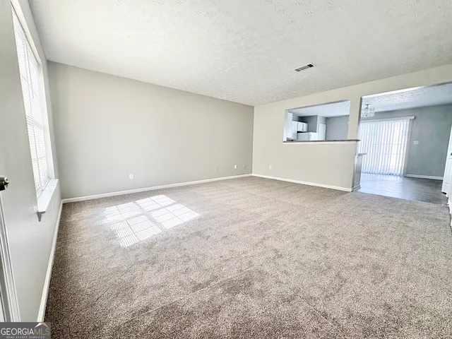 an empty room with a natural light