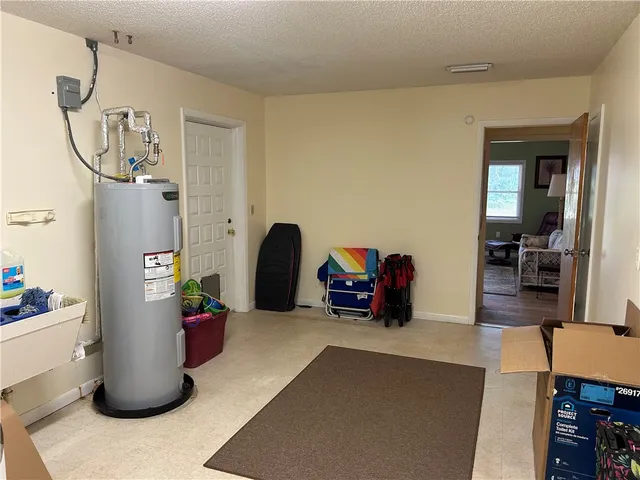 a kitchen with cabinets appliances and a wooden floor