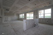 256 Yellow River Way Garner, NC 27529 - Photo 20 of 23 an empty room with windows