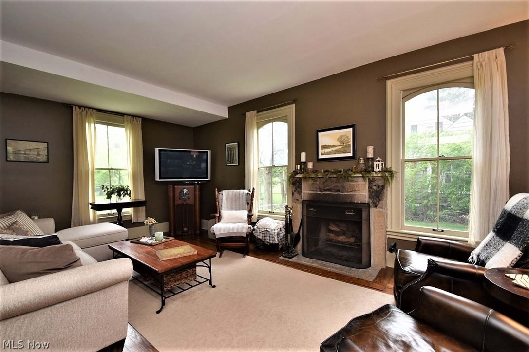 34275 Bainbridge Road Solon, OH 44139 - Photo 11 of 32 Cozy family room with beautiful restored windows and fireplace
