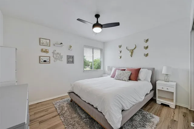 a living room with furniture a rug and a window