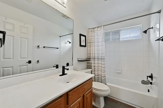 a view of a patio with a table chairs and a backyard