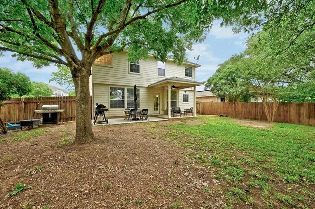 a view of a yard with tree s