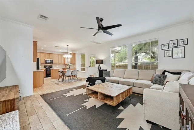 a living room with furniture and a table