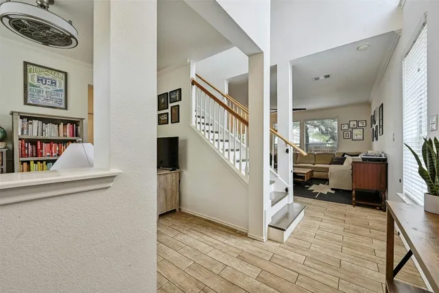 a view of a dining room with furniture and a book shelf