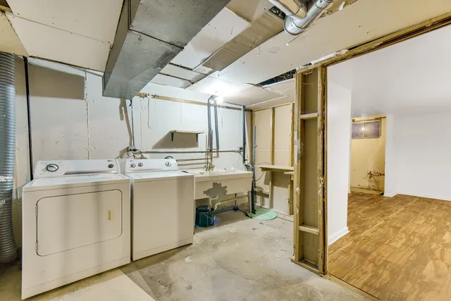 a view of a bathroom with a sink and mirror