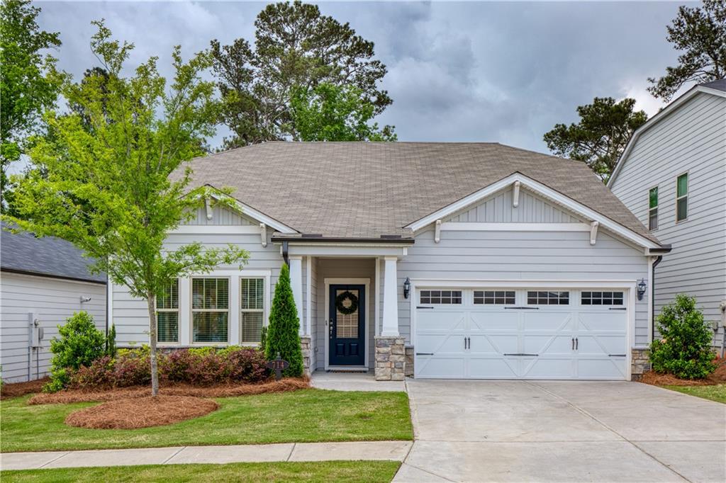 714 Chipping Sparrow Street Canton, GA 30115 - Photo 1 of 1 a view of a house with a yard and plants