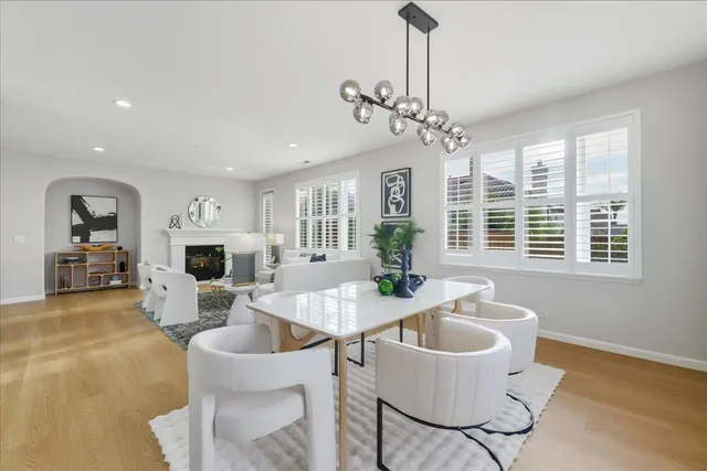 a kitchen with white cabinets and appliances
