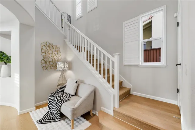 a bedroom with two beds and a lamp