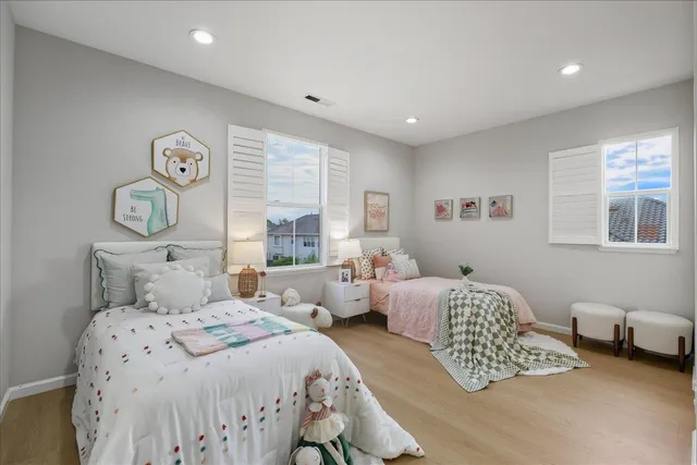 a bedroom with a bed and a couch