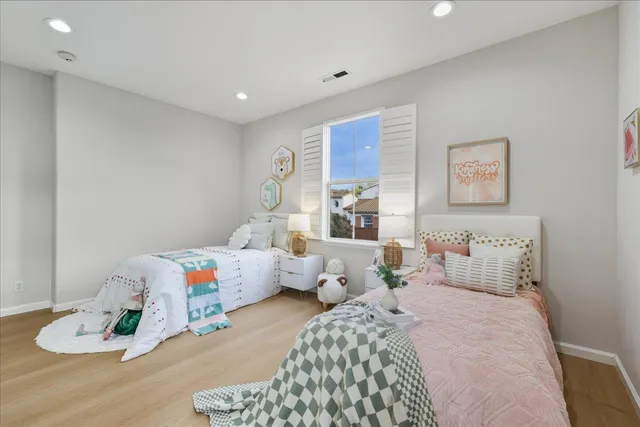 a spacious bedroom with a bed and a couch