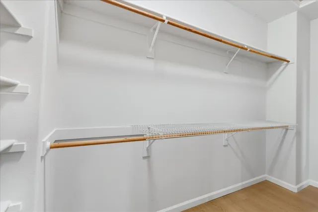 a couple of chairs sitting in backyard of a house