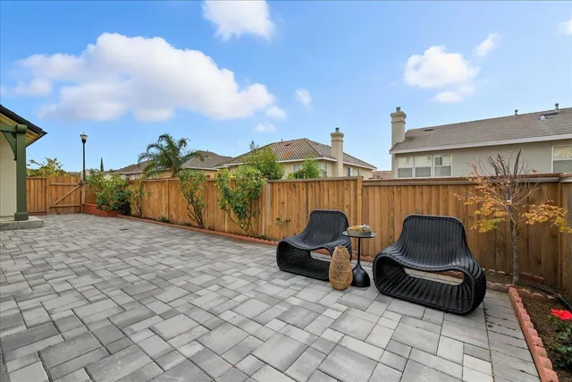 a aerial view of a house next to a yard