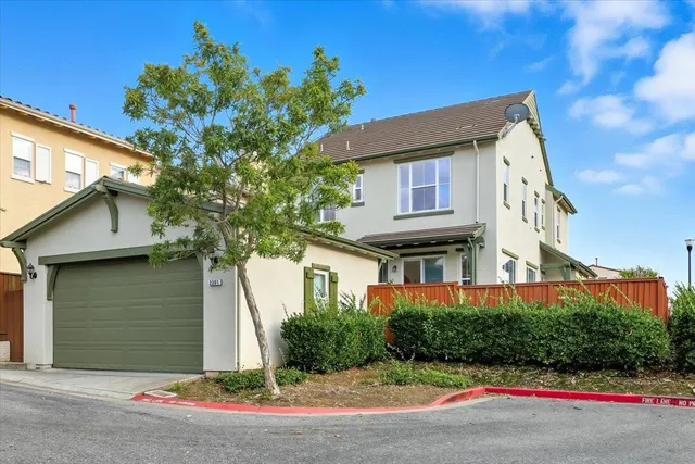 an aerial view of a house with a swimming pool
