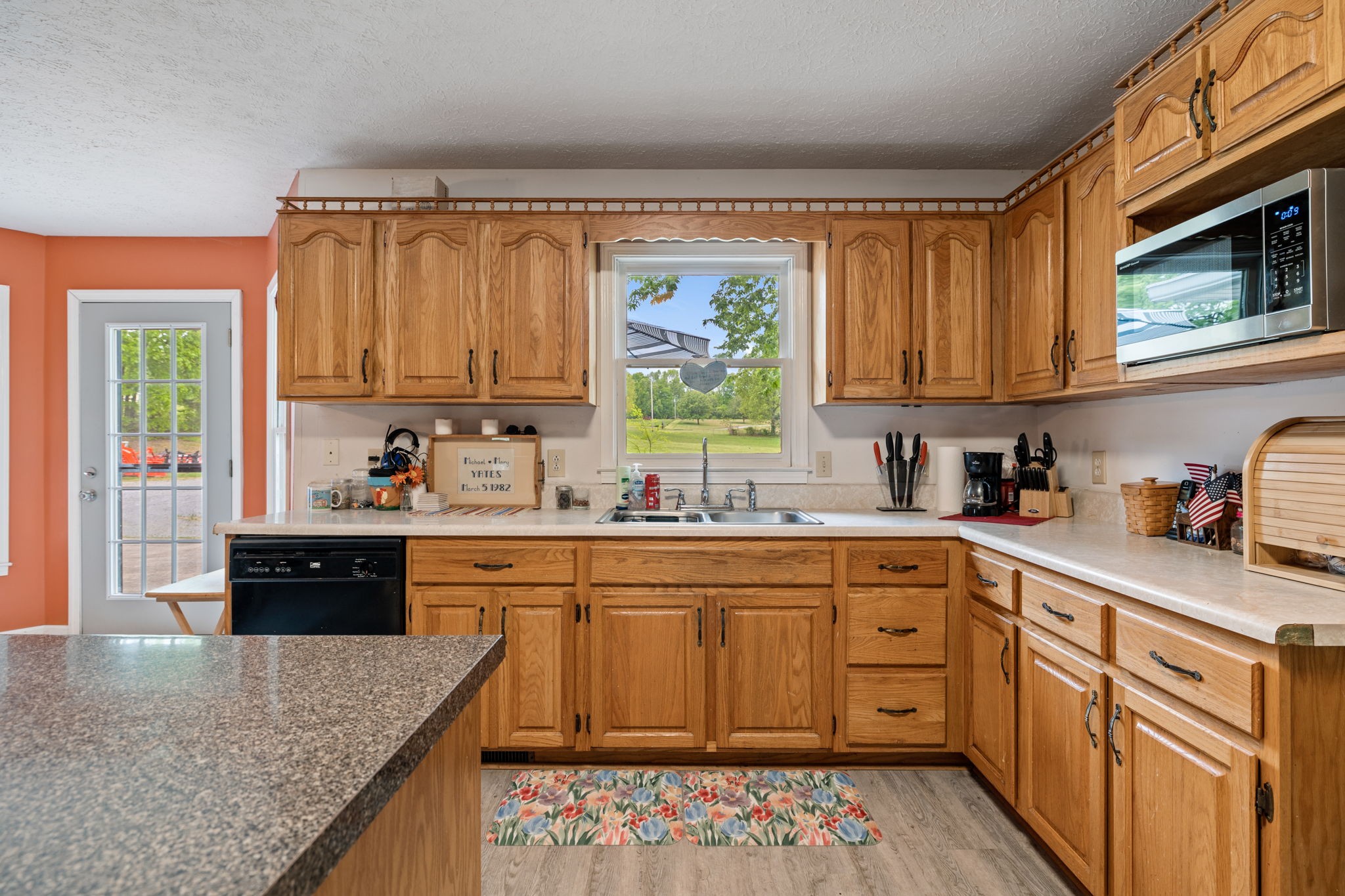 188 Switchboard Road Portland, TN 37148 - Photo 14 of 48 a kitchen with stainless steel appliances granite countertop a stove a sink and a microwave