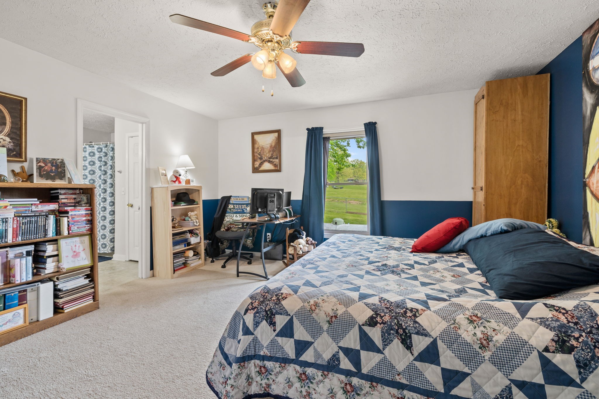 188 Switchboard Road Portland, TN 37148 - Photo 21 of 48 a bedroom with a bed a study table and large window