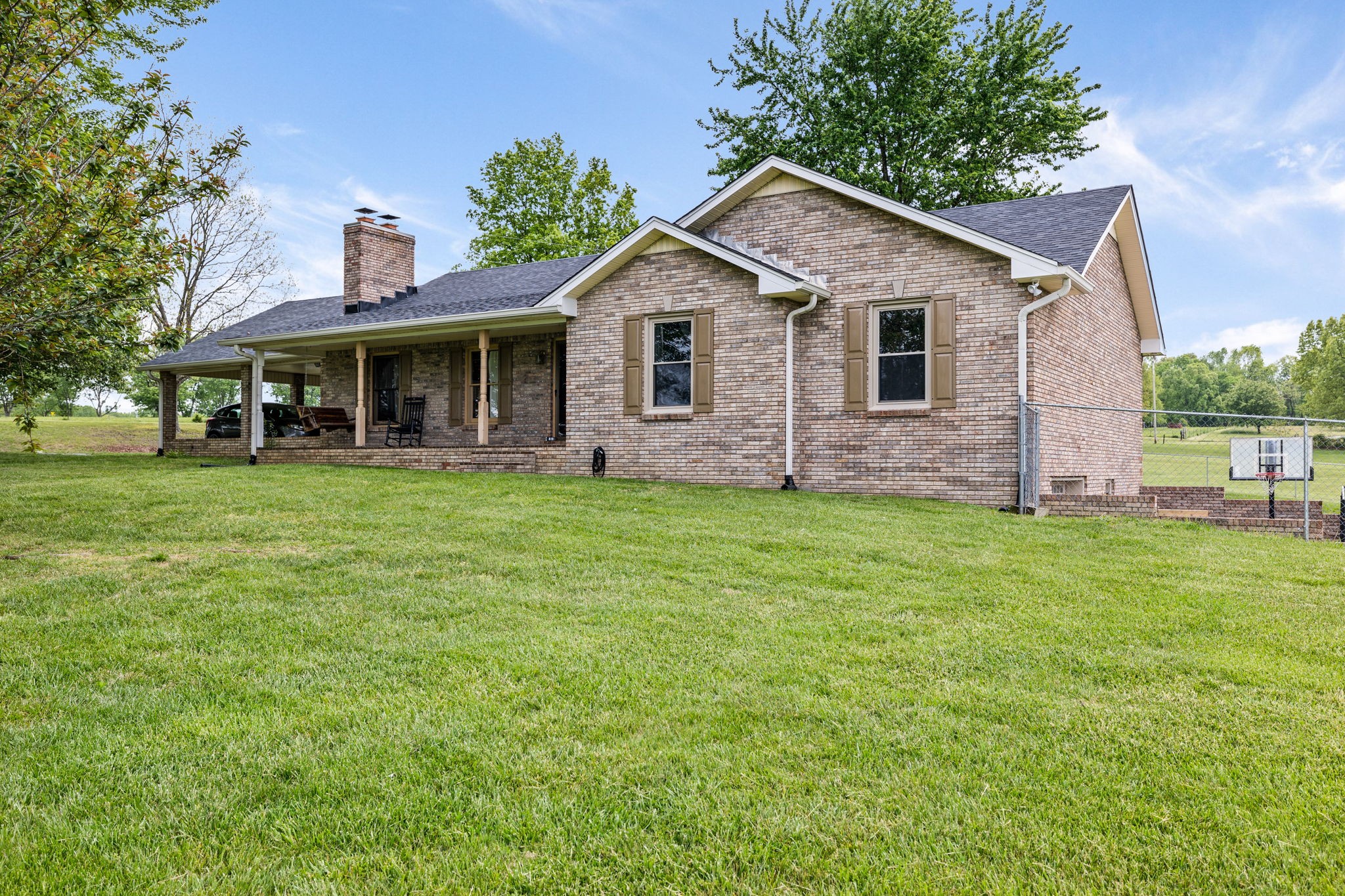 188 Switchboard Road Portland, TN 37148 - Photo 3 of 48 a front view of a house with a yard and trees