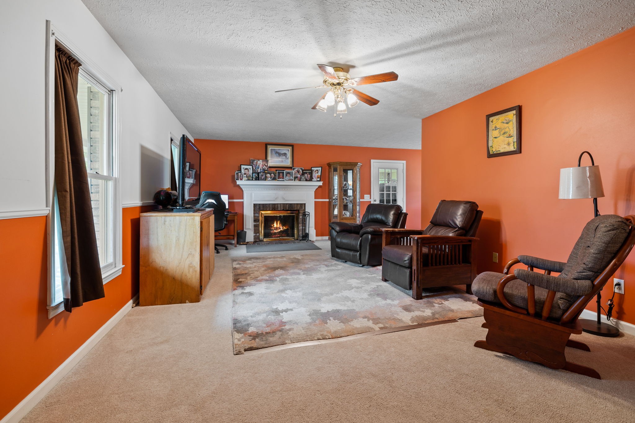 188 Switchboard Road Portland, TN 37148 - Photo 5 of 48 a living room with furniture a fireplace and a flat screen tv