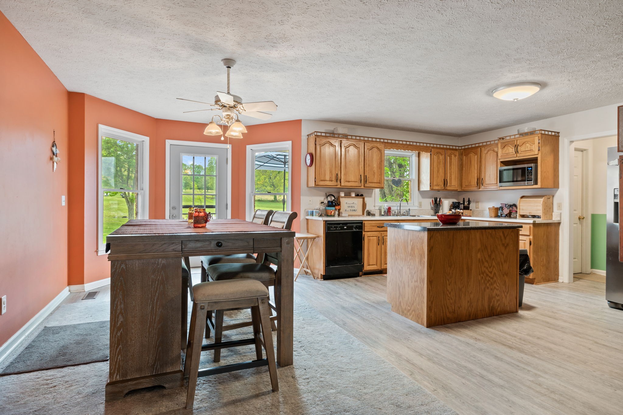 188 Switchboard Road Portland, TN 37148 - Photo 8 of 48 a kitchen with a table chairs refrigerator and cabinets