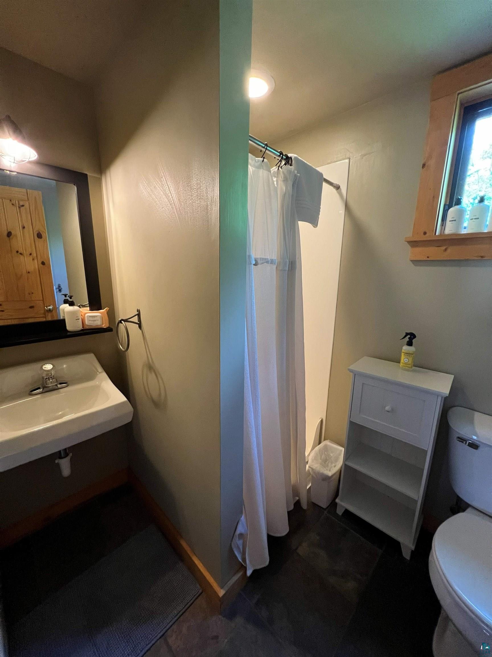 87645 Bjorn Road Bayfield, WI 54814 - Photo 13 of 13 Full bathroom with a stall shower and toilet