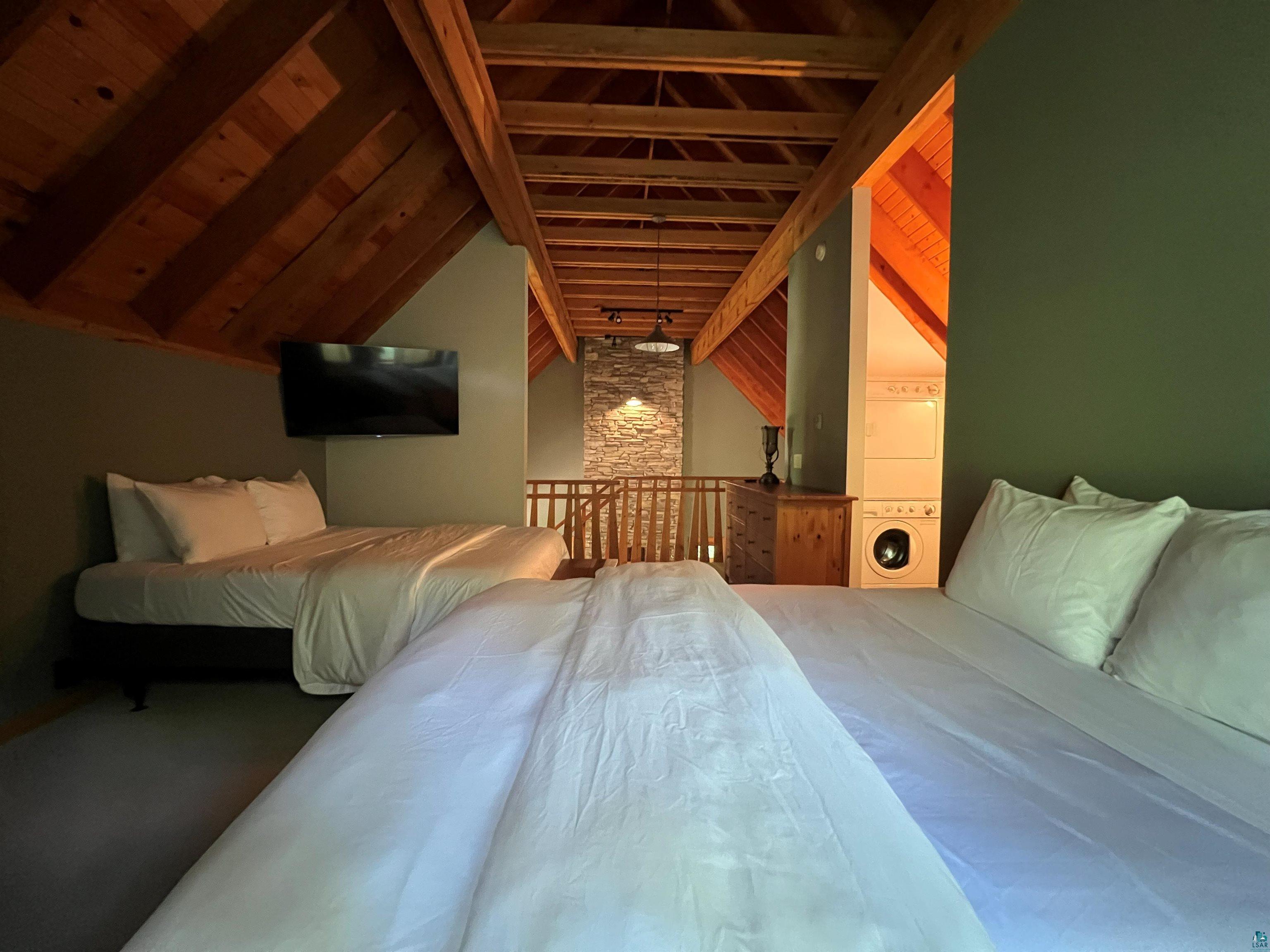 87645 Bjorn Road Bayfield, WI 54814 - Photo 8 of 13 Bedroom featuring lofted ceiling with beams and wooden ceiling