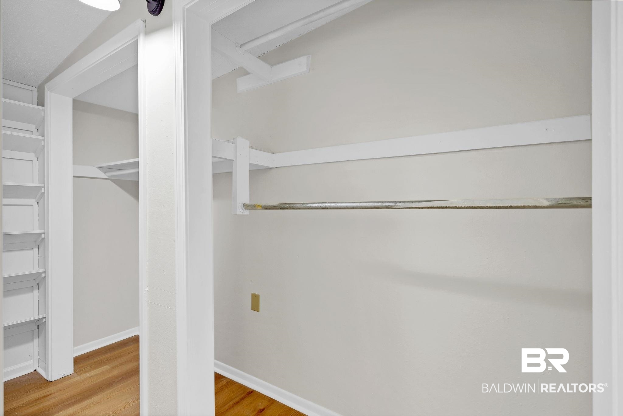 11964 Stroh Road Daphne, AL 36527 - Photo 38 of 58 Walk in closet with wood finished floors