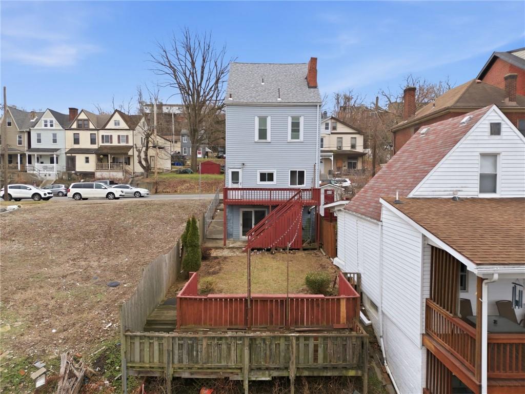 7307 Butler Street Pittsburgh, PA 15206 - Photo 29 of 35 a view of a roof deck with couches and wooden floor
