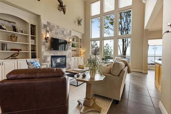 a living room with fireplace furniture and a flat screen tv