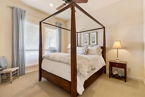a bed room with a bed and a lamp