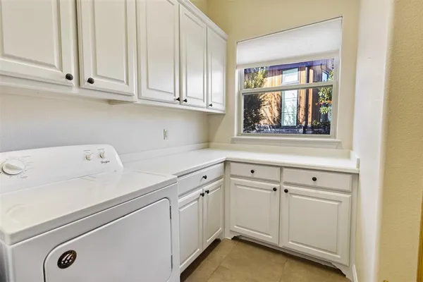 a view of cabinets and window