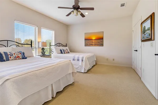 a bedroom with bed and window