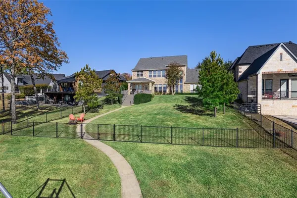 a view of a house with a yard and sitting area