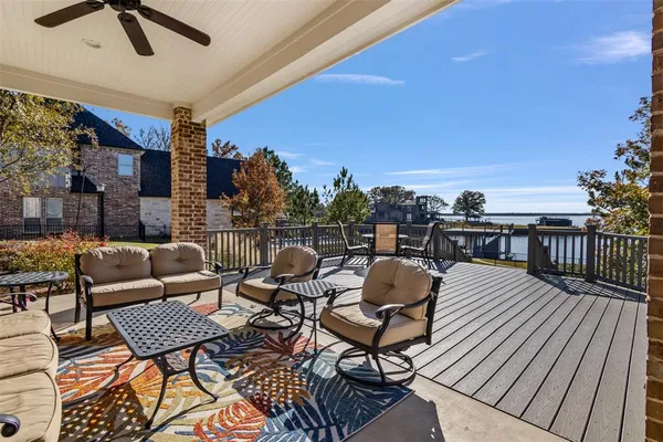 a roof deck with outdoor seating and city view
