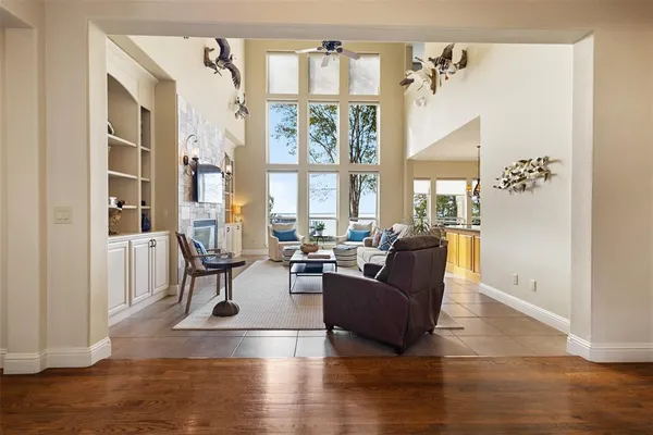 a living room with furniture windows and wooden floor