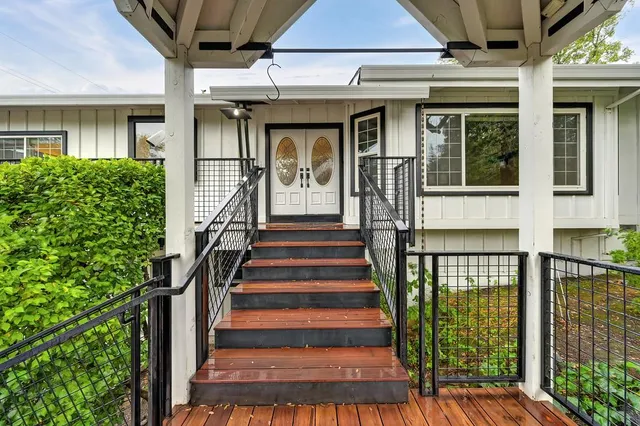 a view of a house with wooden floor and a window