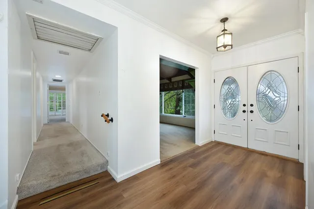 a kitchen with stainless steel appliances granite countertop a sink and a stove