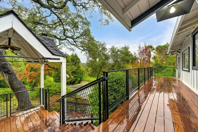 a view of a balcony with wooden floor