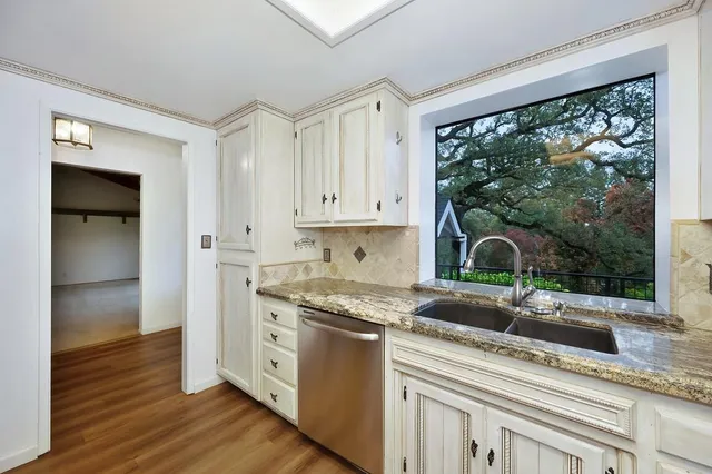 a utility room with cabinets washer and dryer