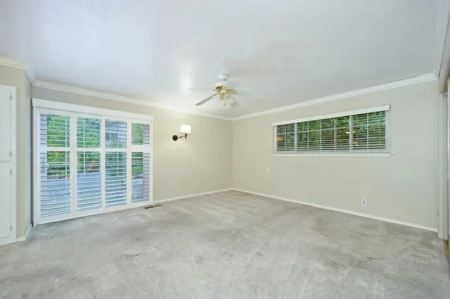a view of a house with a yard and sitting area