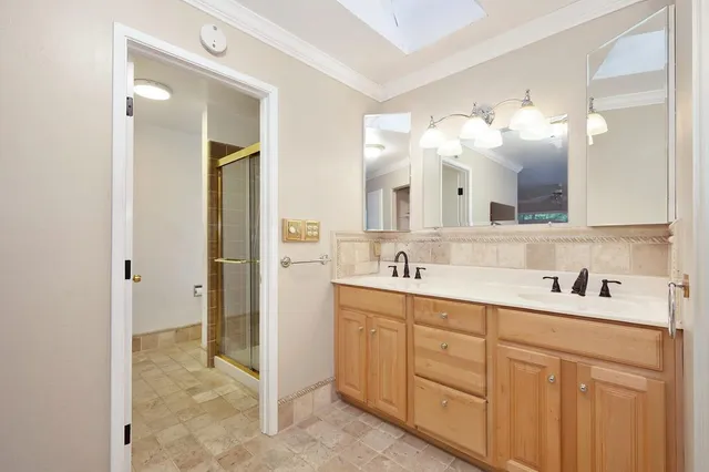 an aerial view of a house with a yard and garden