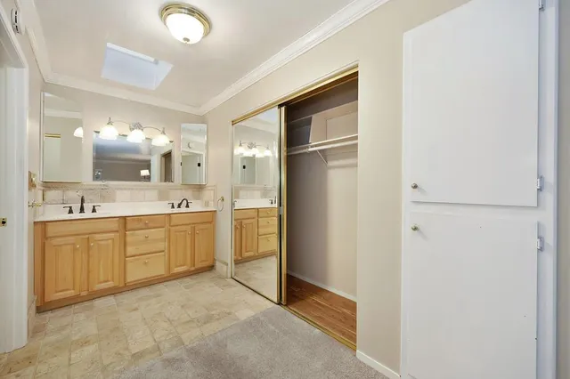 an aerial view of house with yard and mountain view in back