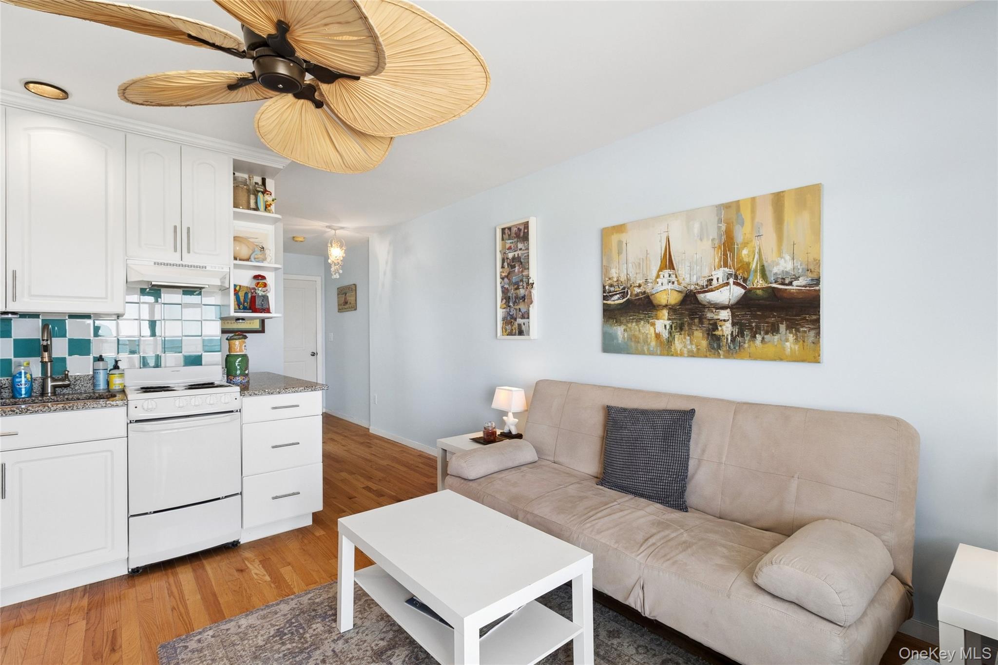 16 Navy Road, Unit 206 Montauk, NY 11954 - Photo 6 of 18 a living room with furniture and kitchen view