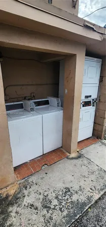 a kitchen with stainless steel appliances granite countertop a sink stove and microwave