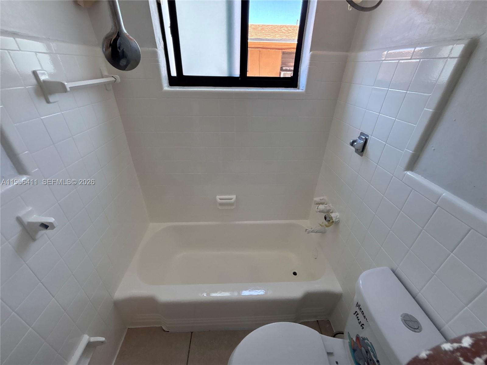 654 West 29th Street, Unit 1 Hialeah, FL 33012 - Photo 12 of 14 a bathroom with a toilet and a shower
