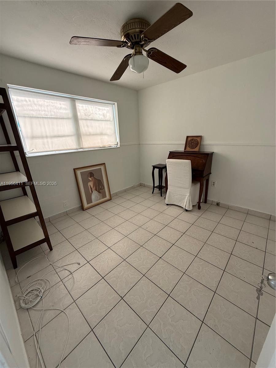 654 West 29th Street, Unit 1 Hialeah, FL 33012 - Photo 6 of 14 a bedroom with furniture and a window
