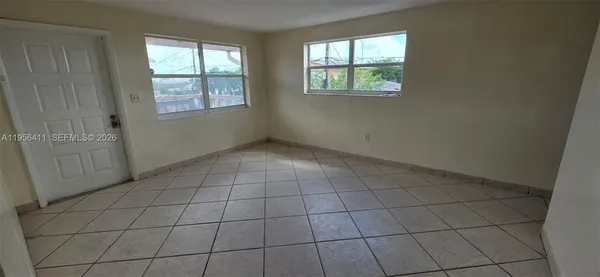 a kitchen with a stove a microwave and a counter top