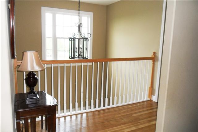 2228 Toby Robertson Road Spring Hill, TN 37174 - Photo 7 of 20 THE UPSTAIRS HAS BEAUTIFUL HARDWOOD FLOORS AND A BALCONY THAT LOOKS INTO THE FOYER.