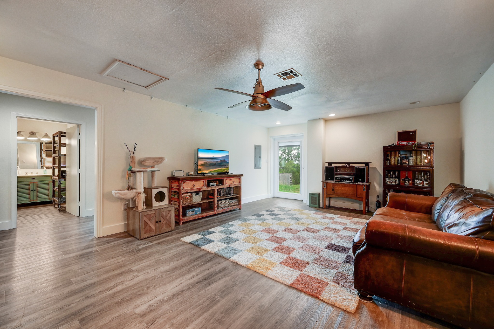 6350 Mt Sharp Road, Unit B Wimberley, TX 78676 - Photo 21 of 34 a living room with furniture and wooden floor