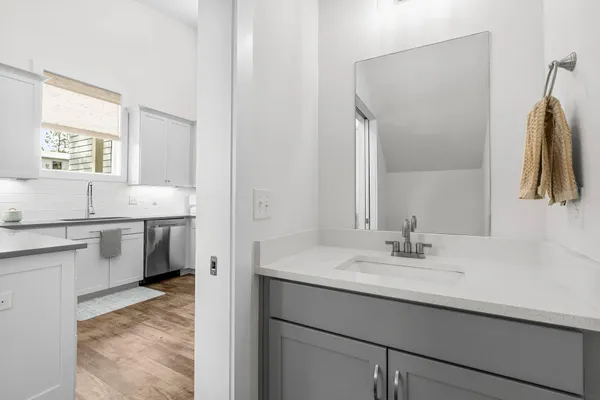 a en suite bathroom with a sink and a mirror